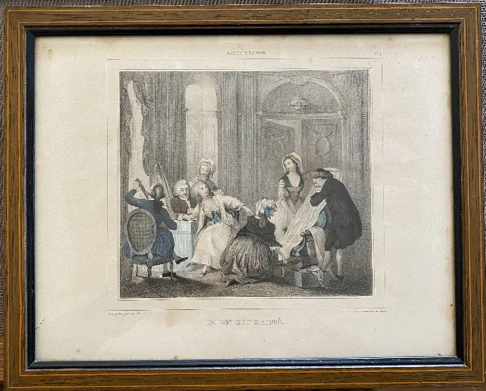 Gravure du XIXème siècle, en polychrome et signée, représentant une scène classique de l'école Française. Encadrée et sous verre. Beaucoup d'élégance et de raffinement.                                               19th century engraving, in polychrome and signed, representing a classic scene from the French school. Framed and under glass. Lots of elegance and refinement.